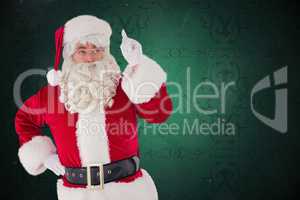 Composite image of serious santa claus pointing his finger