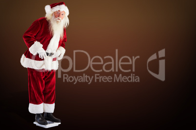 Composite image of santa is surprised about his weight
