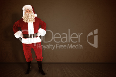 Composite image of portrait of santa claus with hands on hips