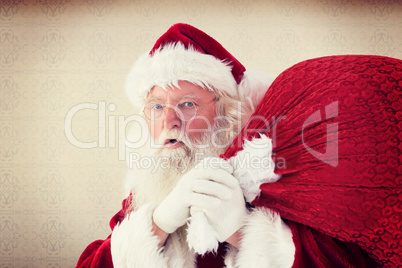 Composite image of santa takes care about his sack