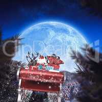 Composite image of santa flying his sleigh