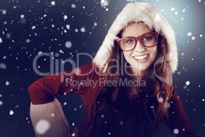 Composite image of festive redhead smiling at camera