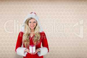 Composite image of pretty girl in santa outfit holding gift