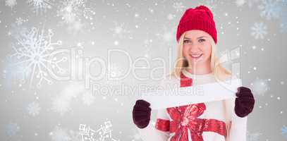 Composite image of festive blonde showing a blank banner