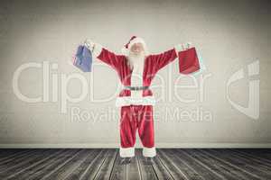 Composite image of santa carrying gifts