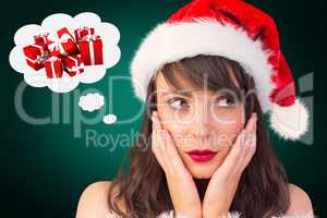 Composite image of pretty santa girl with hands on face