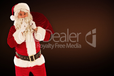 Composite image of santa holding sack and keeping a secret