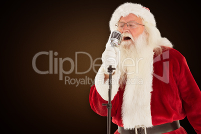 Composite image of santa claus is singing christmas songs