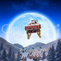 Composite image of santa flying his sleigh