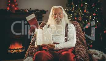 Santa claus showing his book