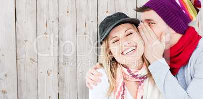 Composite image of young couple sharing a secret