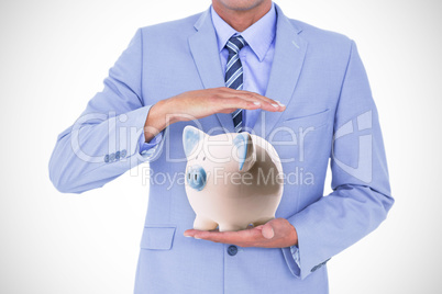 Composite image of handsome businessman gesturing with hands
