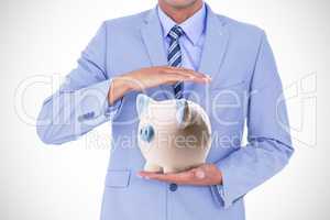 Composite image of handsome businessman gesturing with hands