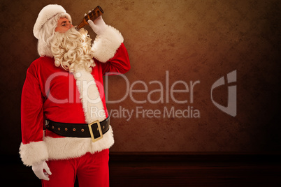 Composite image of father christmas drinking a beer