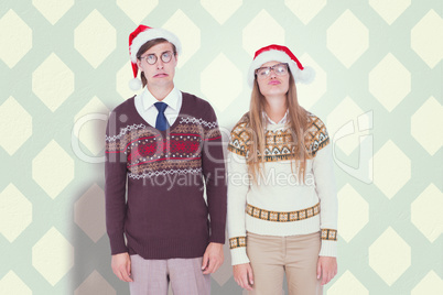 Composite image of sad geeky hipster couple