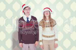 Composite image of sad geeky hipster couple