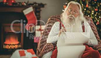 Relaxed santa writing list with a quill