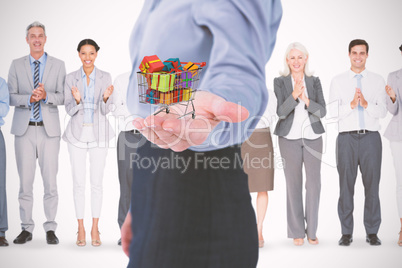 Composite image of businesswoman presenting with hand