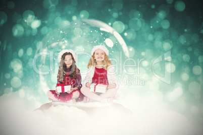 Composite image of festive child in snow globe