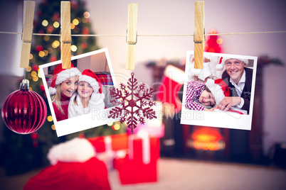 Composite image of hanging christmas photos