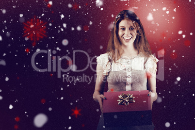 Composite image of pretty redhead offering a gift box