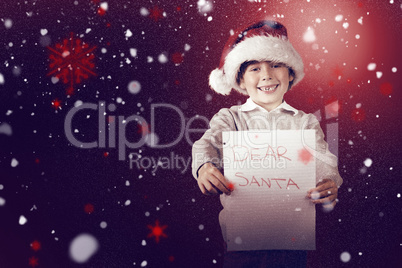 Composite image of festive boy showing letter
