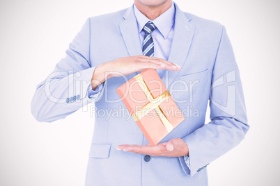 Composite image of handsome businessman gesturing with hands