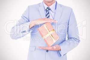 Composite image of handsome businessman gesturing with hands