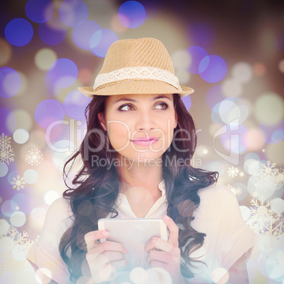 Composite image of pretty brunette holding her phone