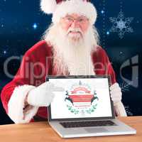 Composite image of happy santa showing laptop screen