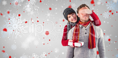 Composite image of woman giving man a present