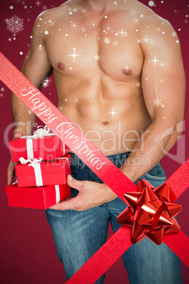 Composite image of attractive bodybuilder with gifts