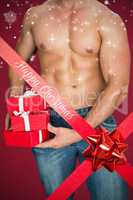 Composite image of attractive bodybuilder with gifts