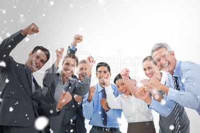 Composite image of business people cheering in office