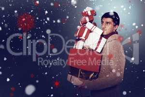 Composite image of young man with many christmas presents