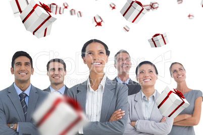 Composite image of business people looking up in office Composite image of business people looking up in office