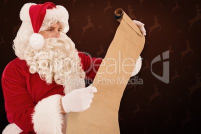 Composite image of santa checking list