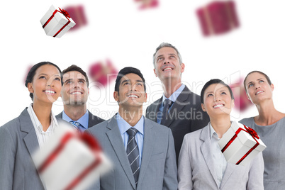 Composite image of business people looking up in office