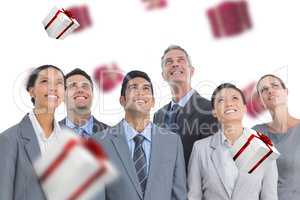 Composite image of business people looking up in office