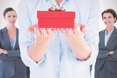 Composite image of womans hands presenting