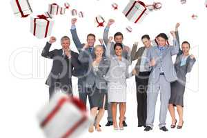 Composite image of excited business team cheering at camera