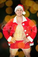 Composite image of smiling muscular man posing in sexy santa out