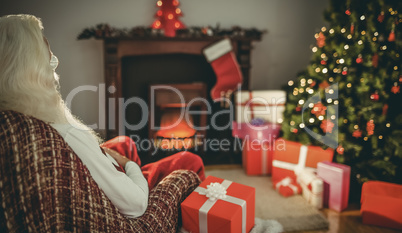 Santa claus sitting on the armchair