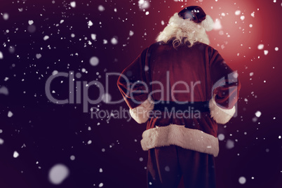 Composite image of rear view of father christmas