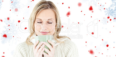 Composite image of happy woman enjoying a hot coffee standing
