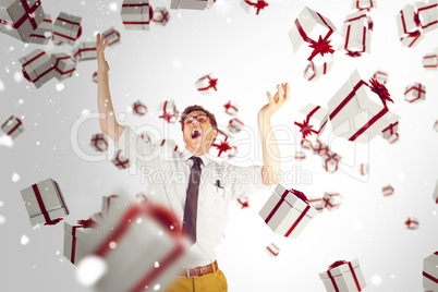 Composite image of geeky businessman standing with arms raised Composite image of geeky businessman standing with arms raised