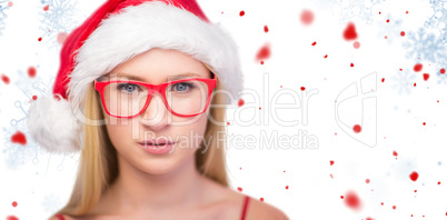 Composite image of festive blonde wearing hipster glasses