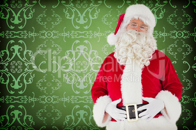 Composite image of santa claus holding his belly