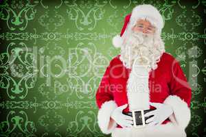 Composite image of santa claus holding his belly