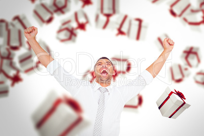 Composite image of cheering businessman